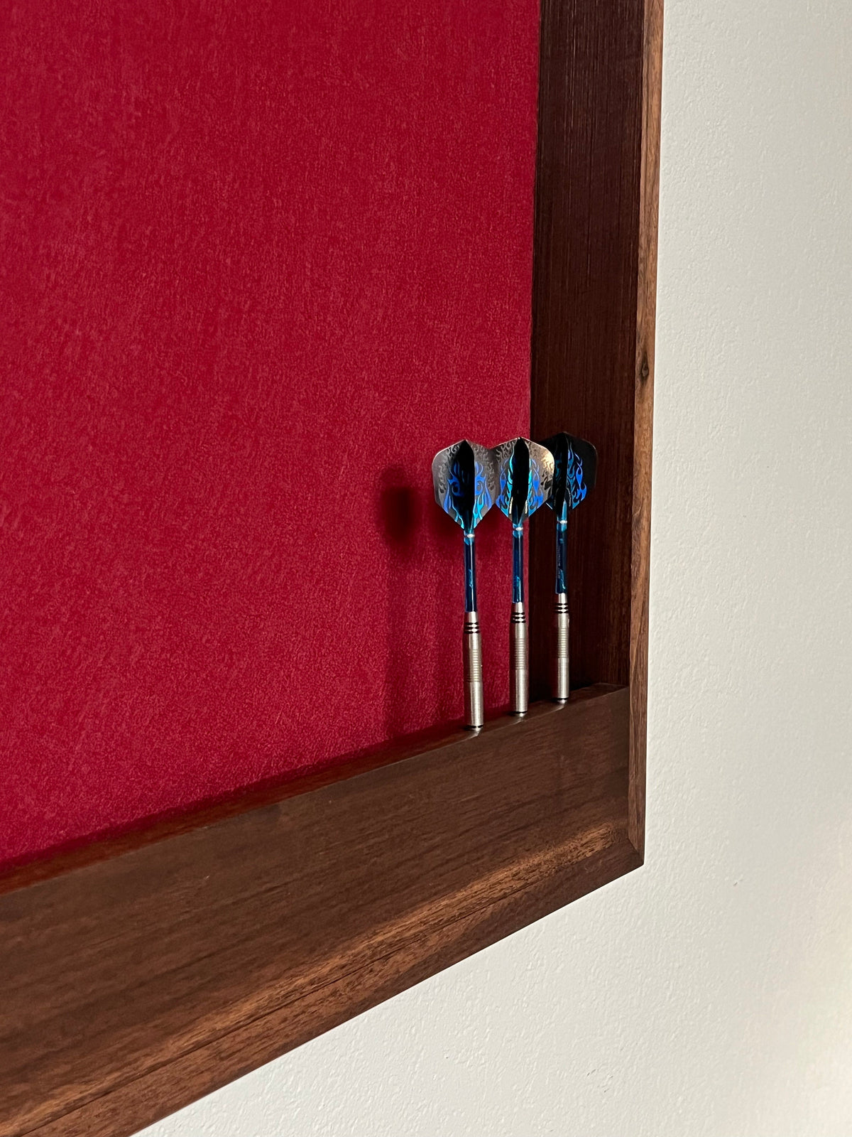 Walnut hardwood dartboard cabinet 32" x 32" x 3.5" with dart storage ruby red felt wrapped around the foam backer.